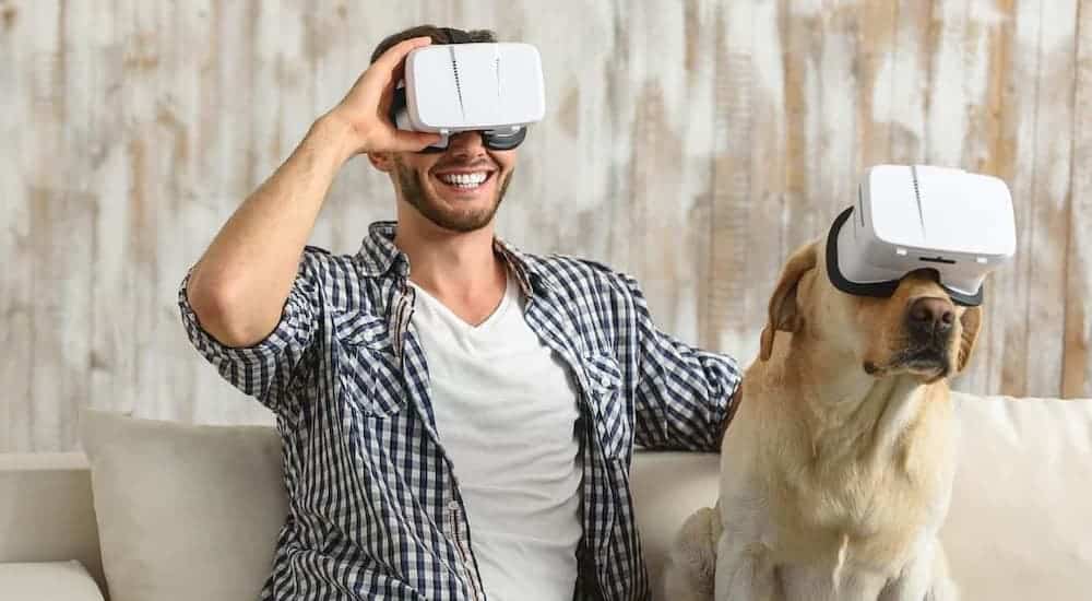 Man and dog wearing VR devices