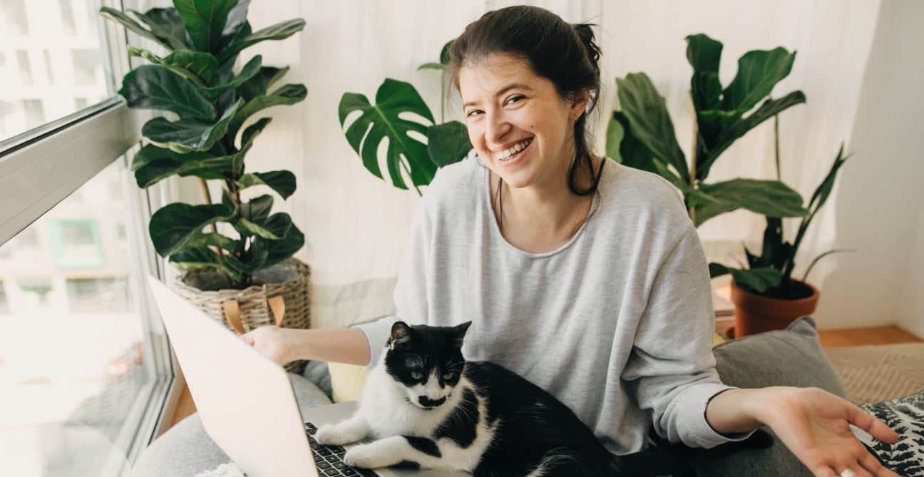 Woman works from home with her cat